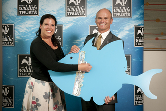 Caroline_Nokes_MP_with_Simon_King_OBE_wildlife trust backdrop banner