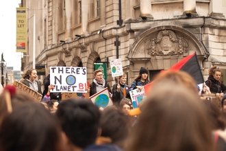 People campaigning with a 'No planet B' sign