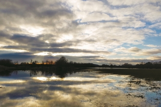 Coombe Hill nature reserve floodplains at sunset