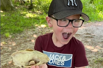 Boy holding skull