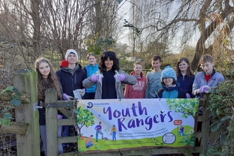 Young people at the gate of the learning area 