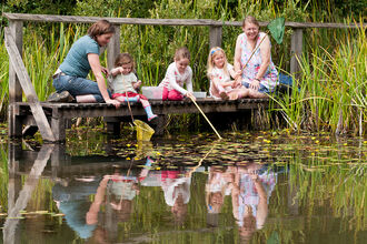 3 children and 2 adults pond dipping
