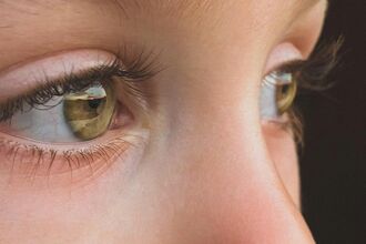 An amber eyed child with a nose