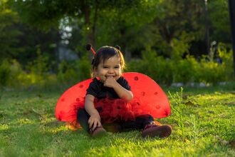Child in a ladybird outfit