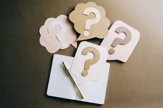 Book with questionmarks on