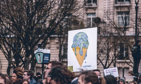 Climate change poster featuring an earth melting in an ice cream cone