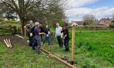 Volunteers laughing after the strength of the post rammers brought it too low!