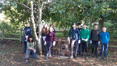 Young people with their bug hotel