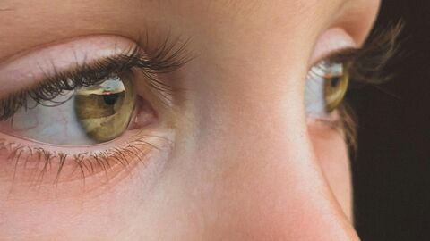 An amber eyed child with a nose