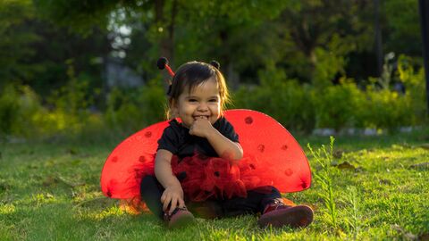 Child in a ladybird outfit