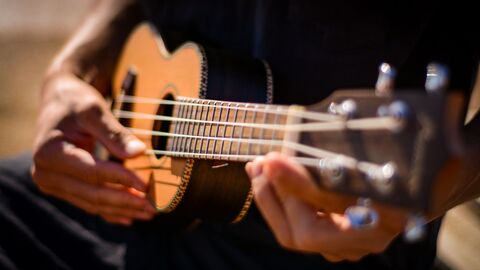 Ukulele being played by one person