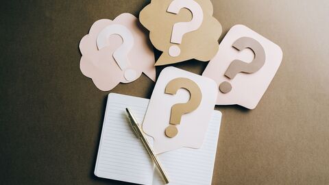 Book with questionmarks on