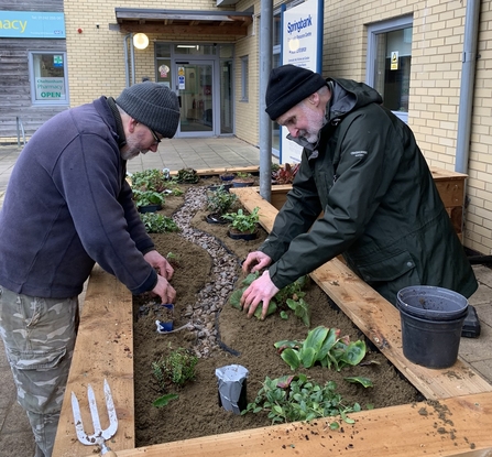 Waterscapes volunteers planting a rain garden