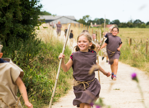 Children running down the track at Greystones Farm