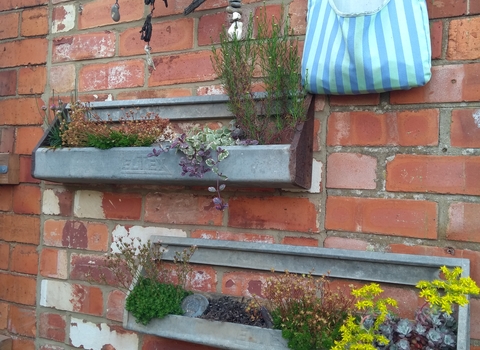 A wall with two planters